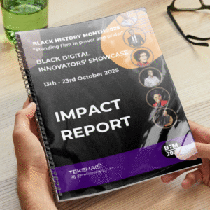 Hands holding a copy of the impact report at a desk